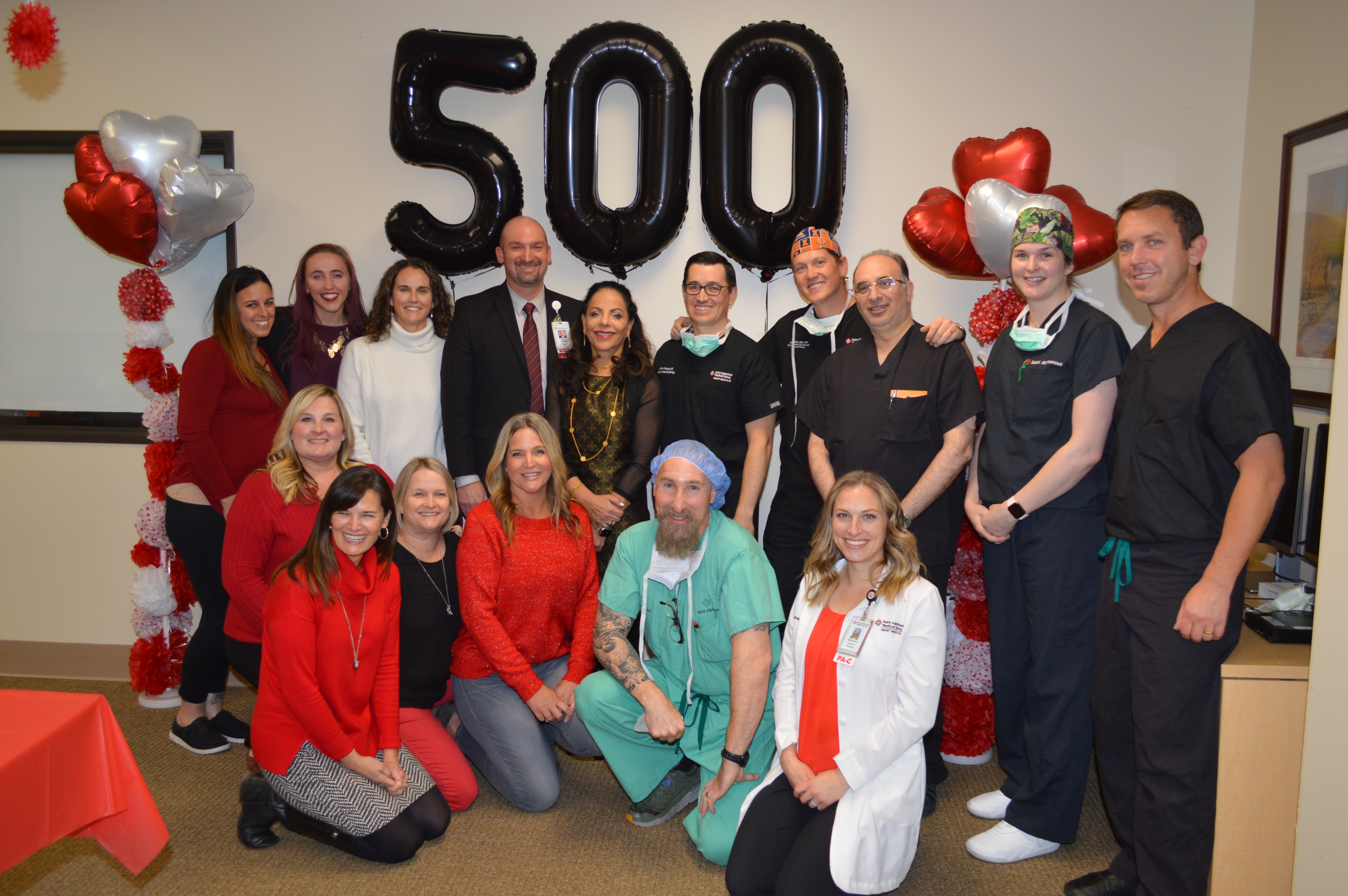 Saint Alphonsus Structural Heart team and hospital leaders commemorate the 500th TAVR procedure